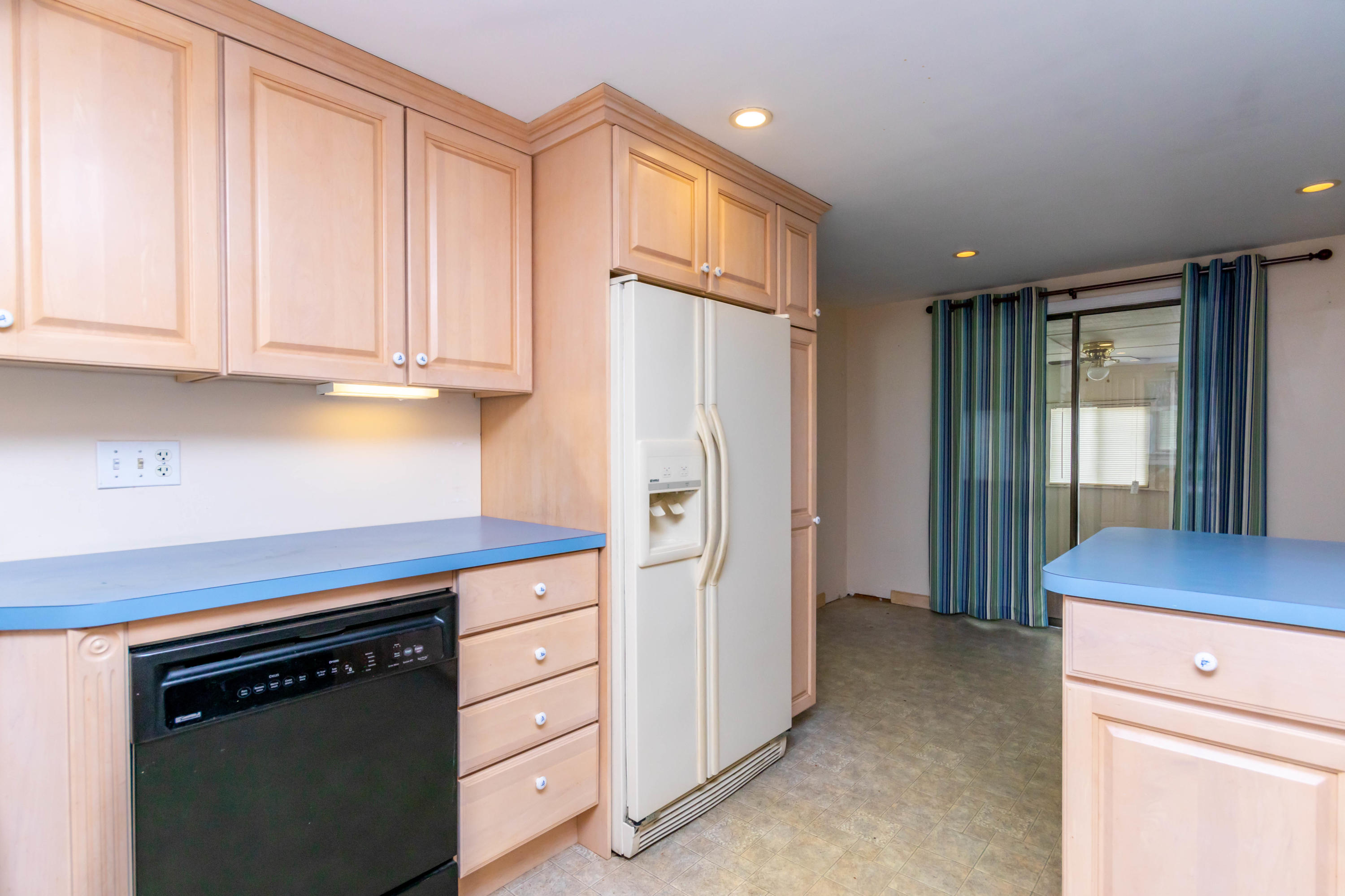 57 Puritan Road Buzzards Bay, MA 02532 - Photo 7 of 27 a kitchen with stainless steel appliances granite countertop a refrigerator sink and cabinets
