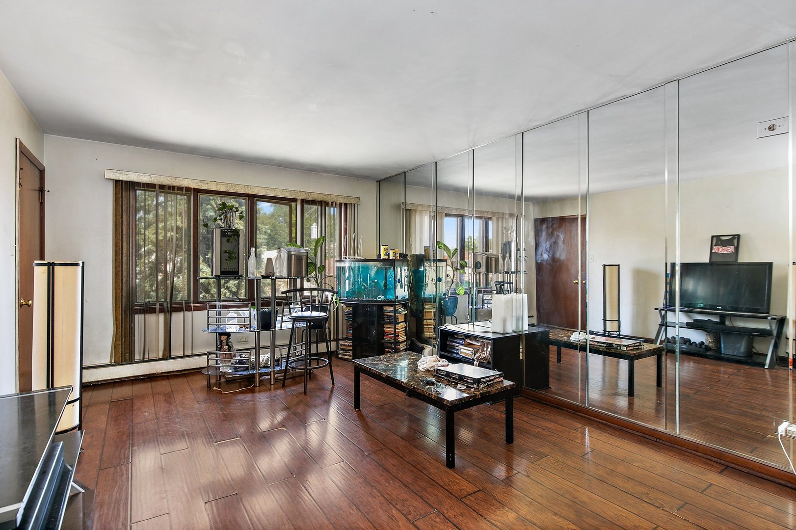 1955 Vermont Avenue Blue Island, IL 60406 - Photo 13 of 34 a living room with furniture large windows and wooden floor
