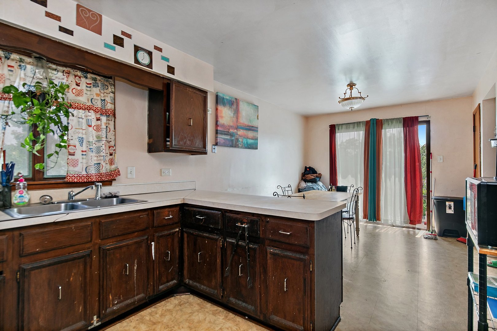 1955 Vermont Avenue Blue Island, IL 60406 - Photo 15 of 34 a kitchen with a sink stove and cabinets
