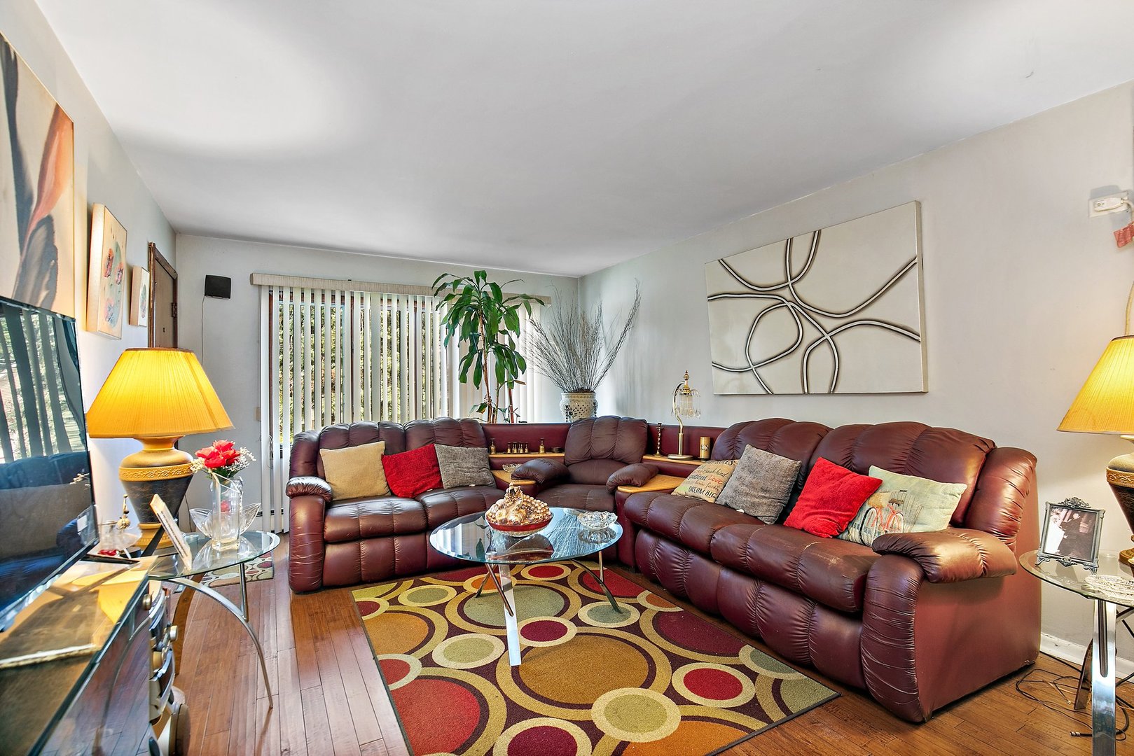 1955 Vermont Avenue Blue Island, IL 60406 - Photo 2 of 34 a living room with furniture and a lamp