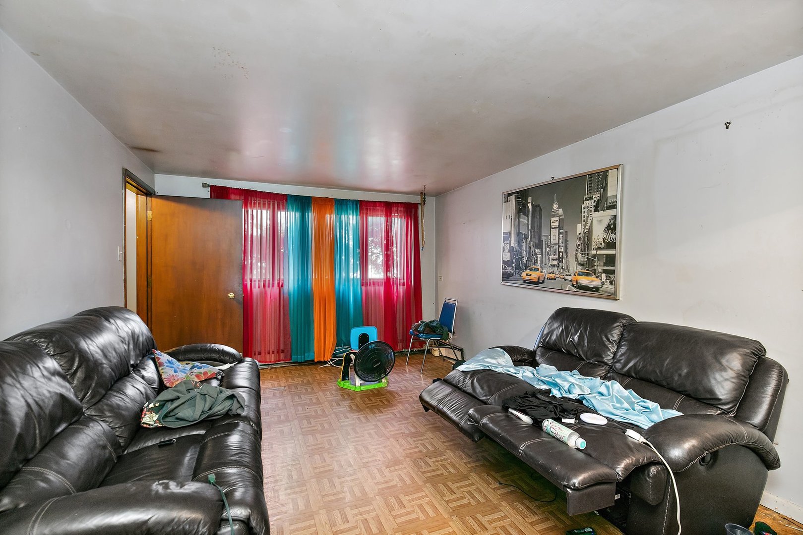1955 Vermont Avenue Blue Island, IL 60406 - Photo 22 of 34 a living room with furniture ceiling fan and a window