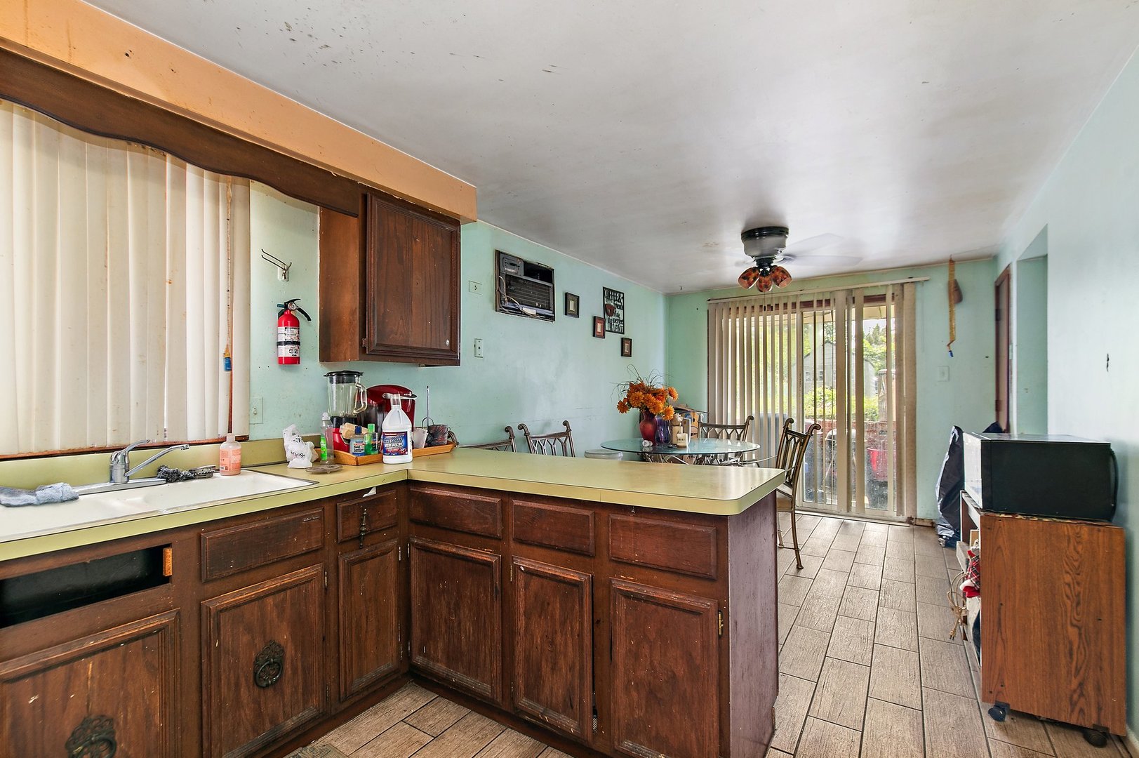 1955 Vermont Avenue Blue Island, IL 60406 - Photo 28 of 34 a kitchen with a sink stove and cabinets