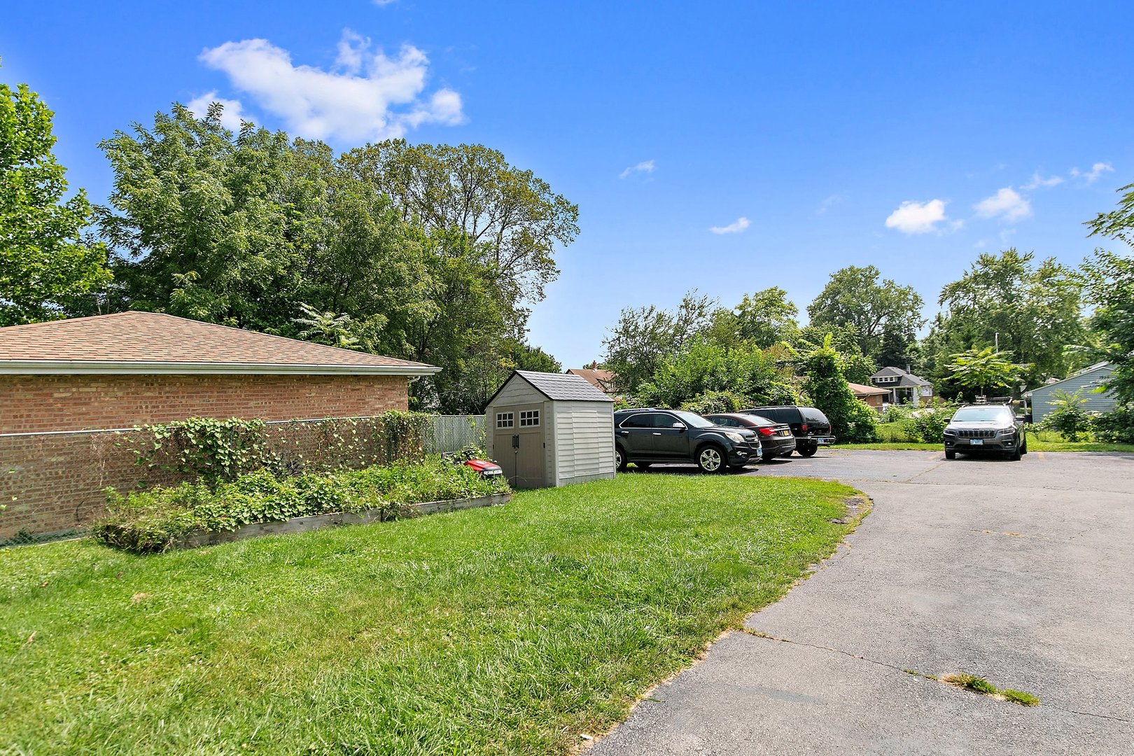 1955 Vermont Avenue Blue Island, IL 60406 - Photo 32 of 34 a view of a garden with large trees