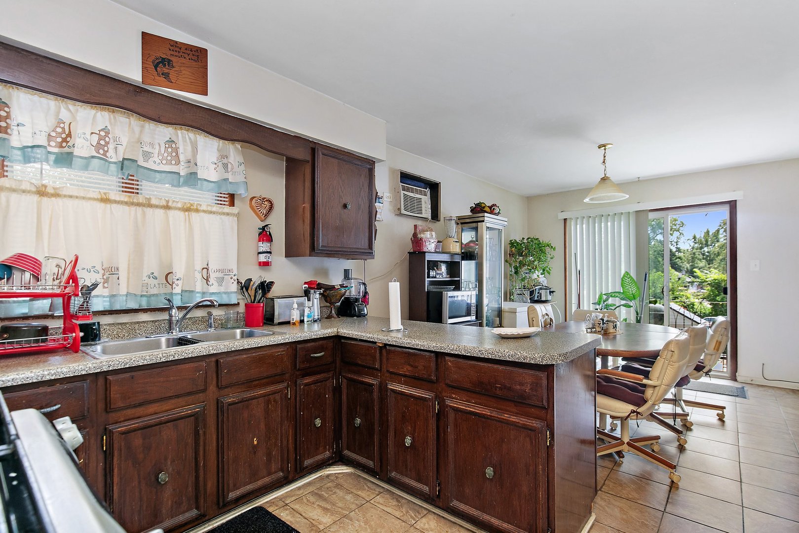 1955 Vermont Avenue Blue Island, IL 60406 - Photo 5 of 34 a kitchen with a sink stove and cabinets