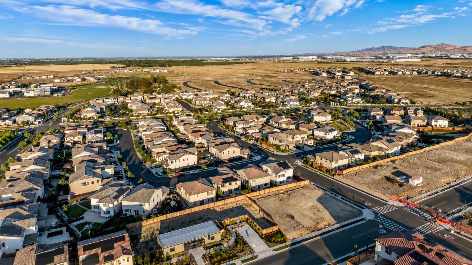 1837 South La Barbera Avenue Mountain House, CA 95391 - Photo 50 of 54 an aerial view of residential building with parking space
