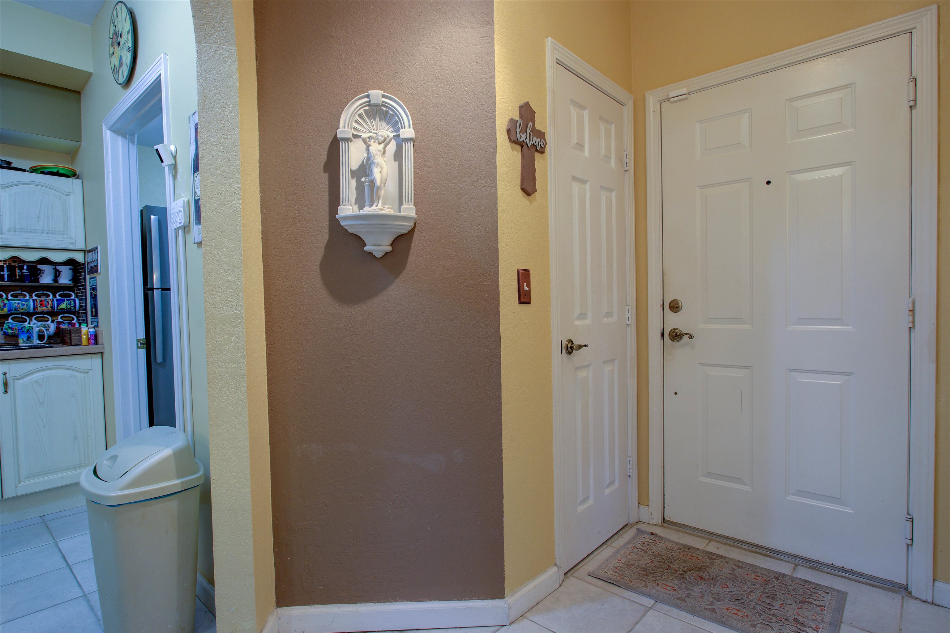1800 Vista Cove Road St. Augustine, FL 32084 - Photo 17 of 58 Foyer entrance with light tile patterned flooring and a textured wall