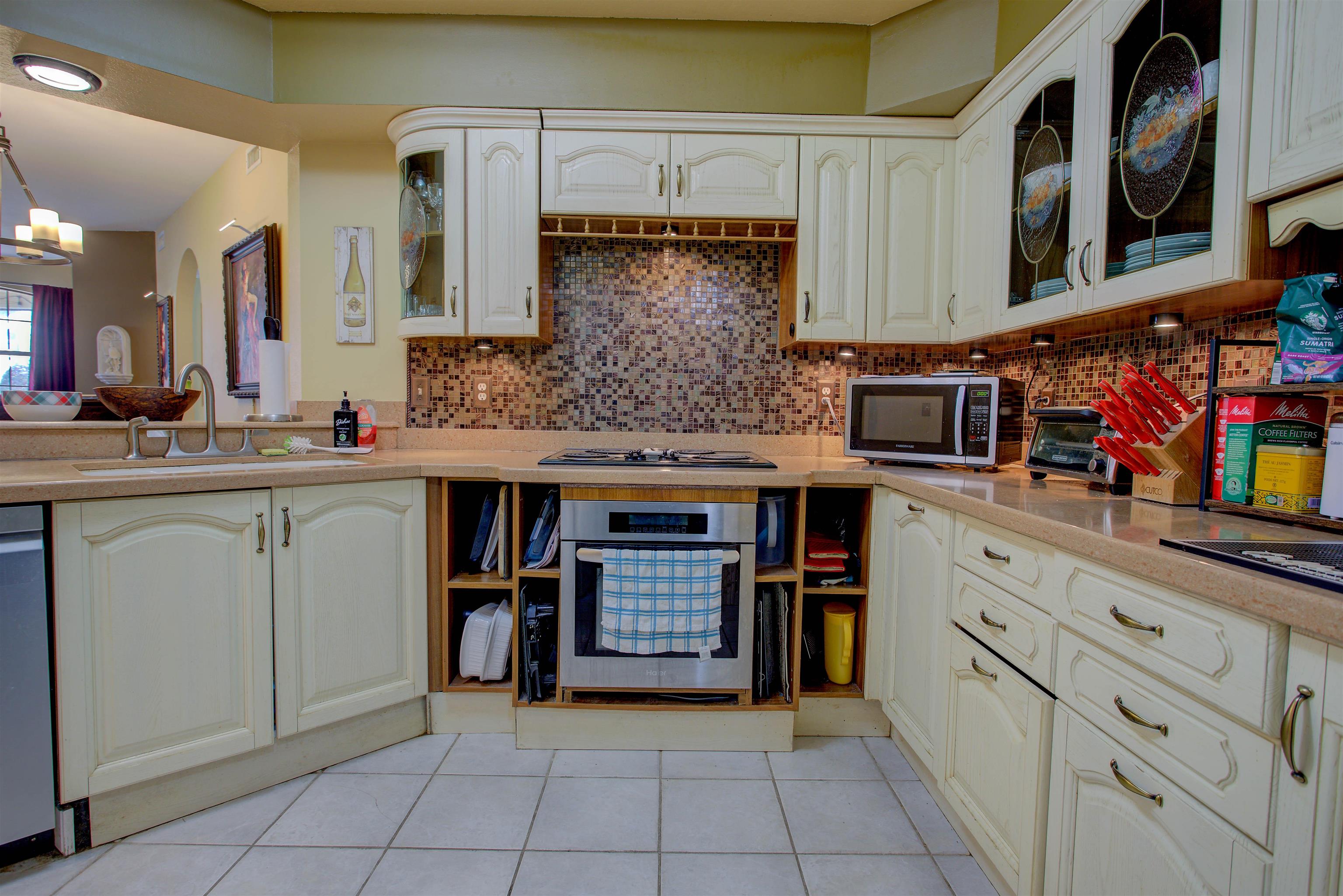 1800 Vista Cove Road St. Augustine, FL 32084 - Photo 20 of 58 a kitchen with stainless steel appliances granite countertop a sink and cabinets