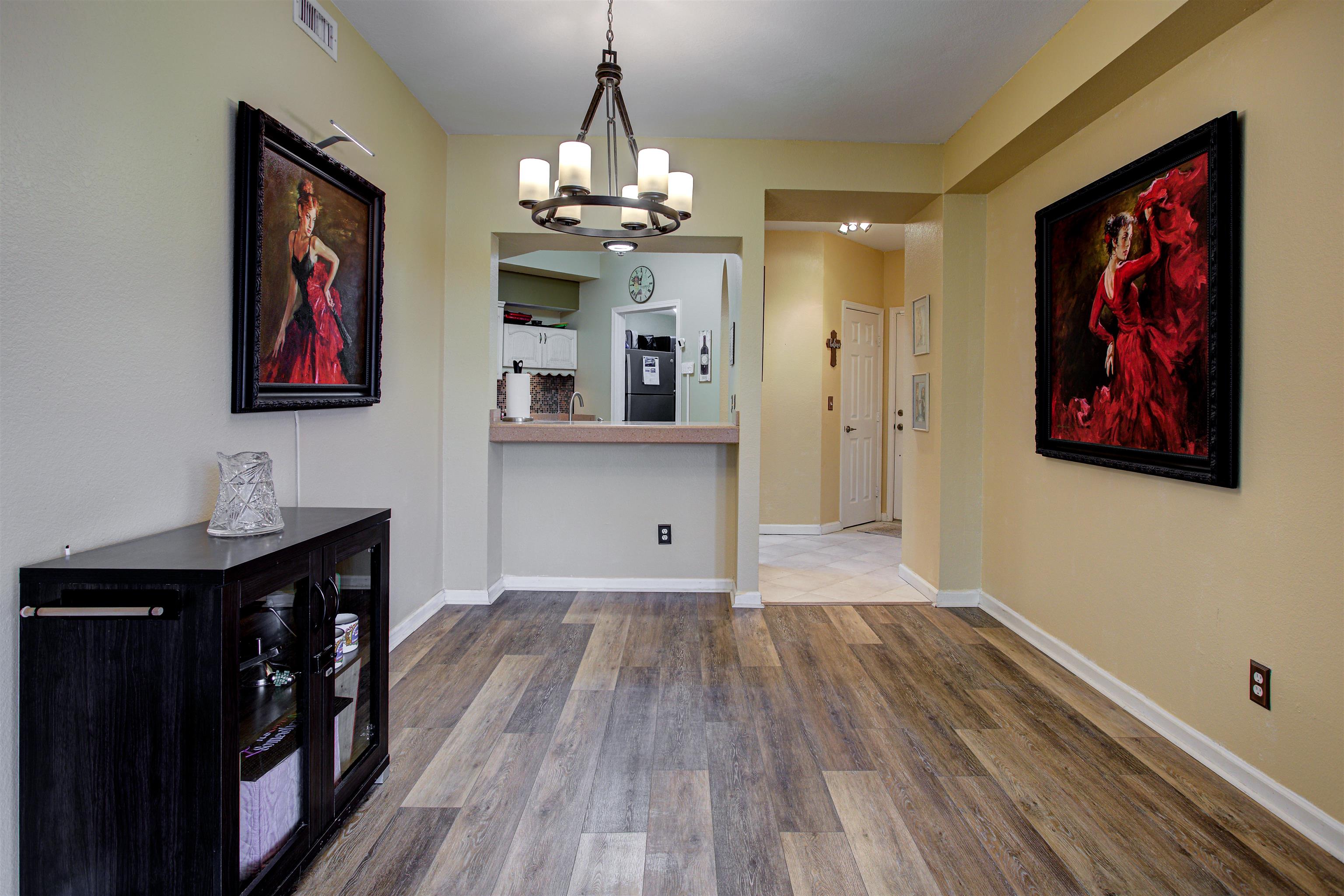 1800 Vista Cove Road St. Augustine, FL 32084 - Photo 2 of 69 Unfurnished dining area with suspended lighting and dark wood-type flooring