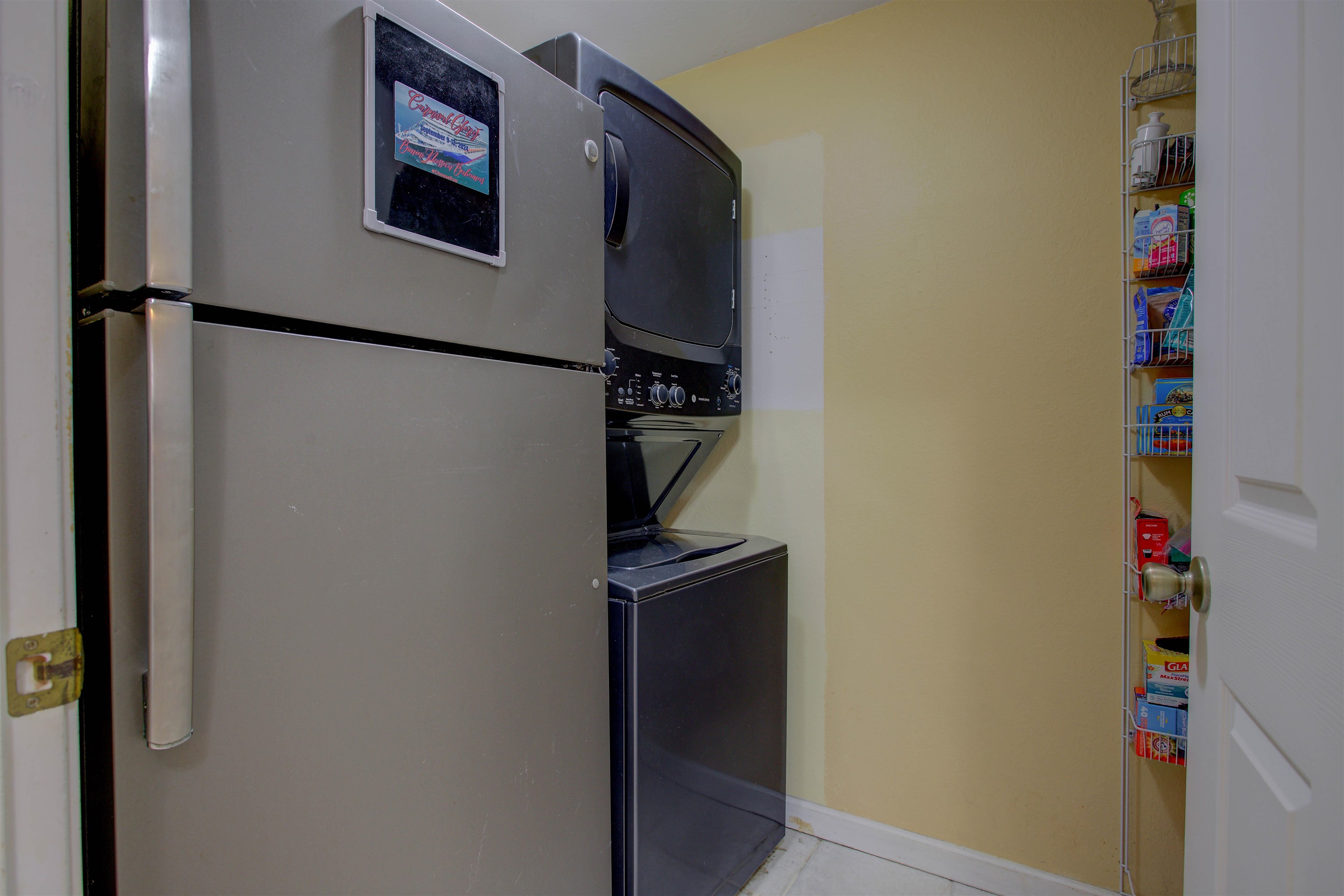 1800 Vista Cove Road St. Augustine, FL 32084 - Photo 21 of 58 Washroom with stacked washing machine and dryer and light tile patterned floors