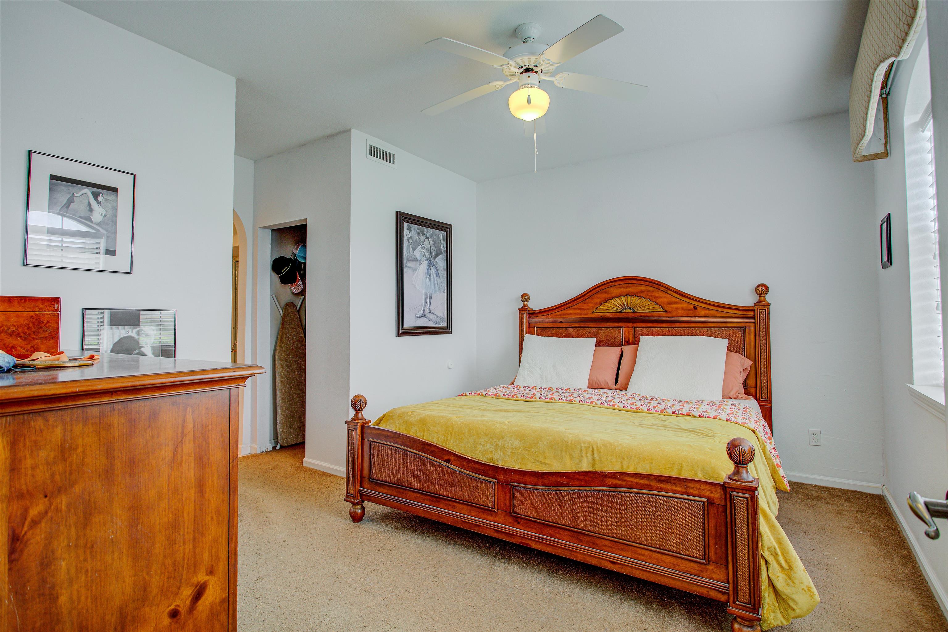 1800 Vista Cove Road St. Augustine, FL 32084 - Photo 24 of 69 Bedroom featuring light colored carpet and ceiling fan