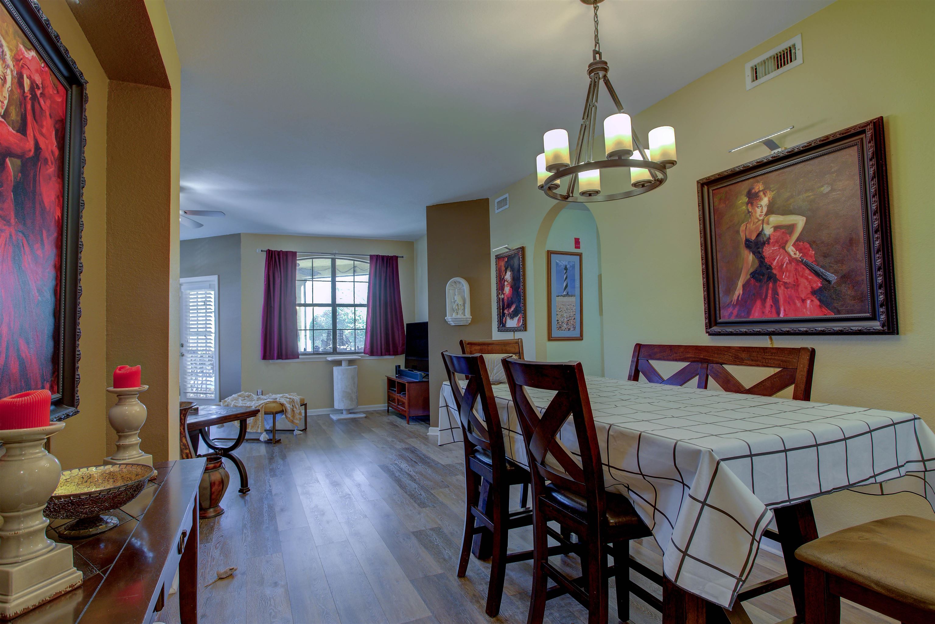 1800 Vista Cove Road St. Augustine, FL 32084 - Photo 24 of 58 a view of a dining room with furniture wooden floor and a chandelier