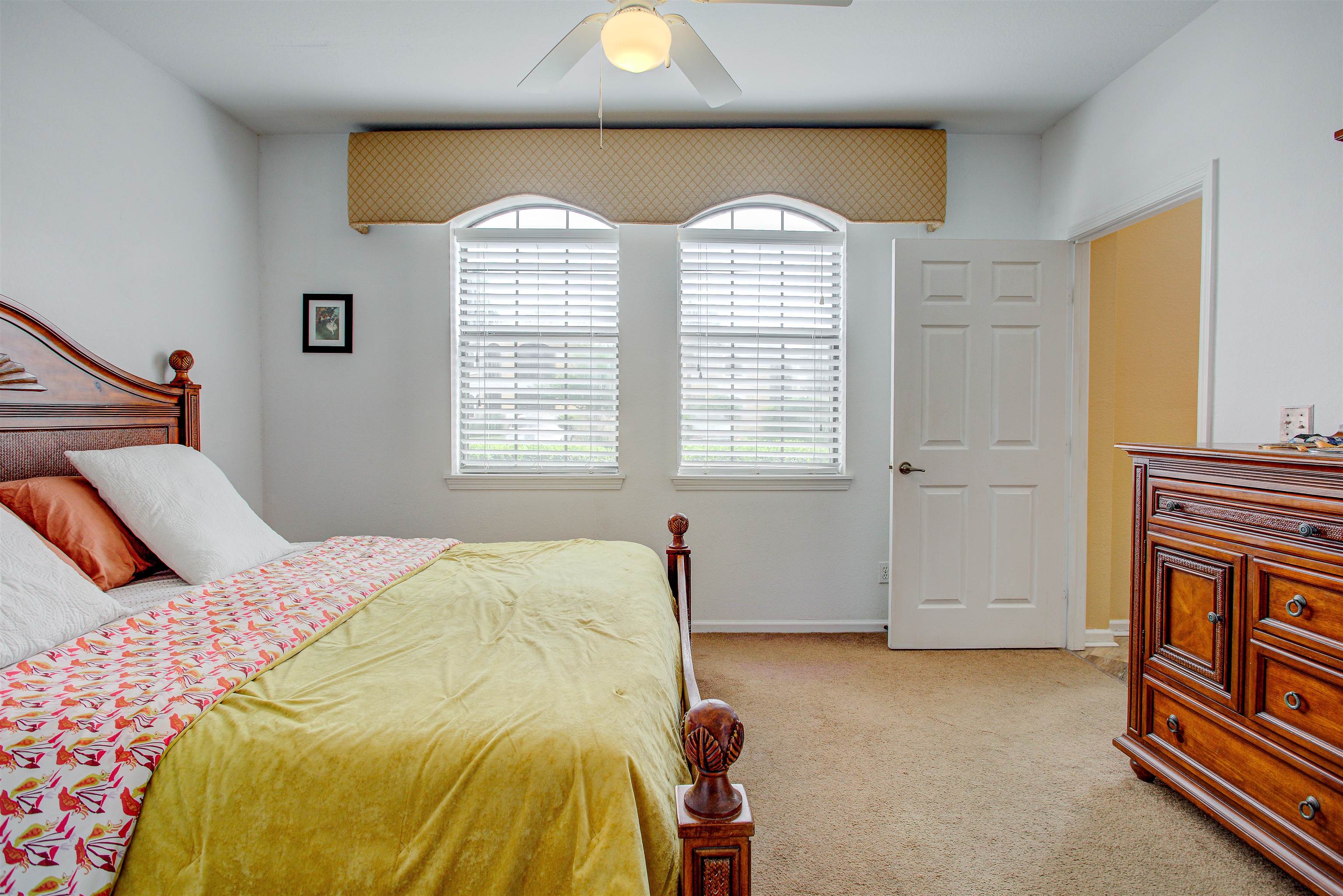 1800 Vista Cove Road St. Augustine, FL 32084 - Photo 26 of 69 Bedroom with light carpet and a ceiling fan