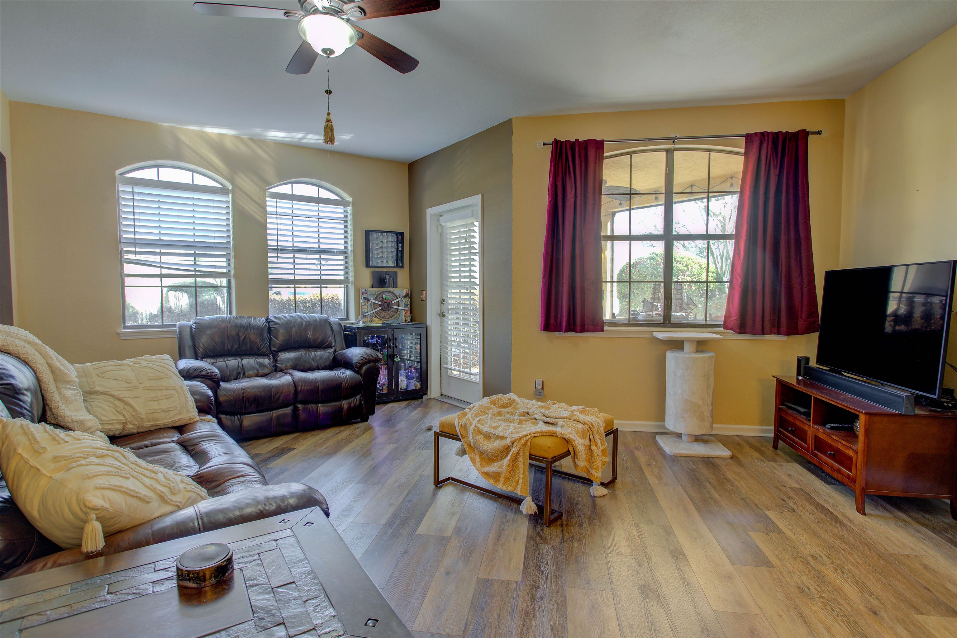 1800 Vista Cove Road St. Augustine, FL 32084 - Photo 27 of 58 Living room featuring light wood-type flooring, plenty of natural light, and a ceiling fan