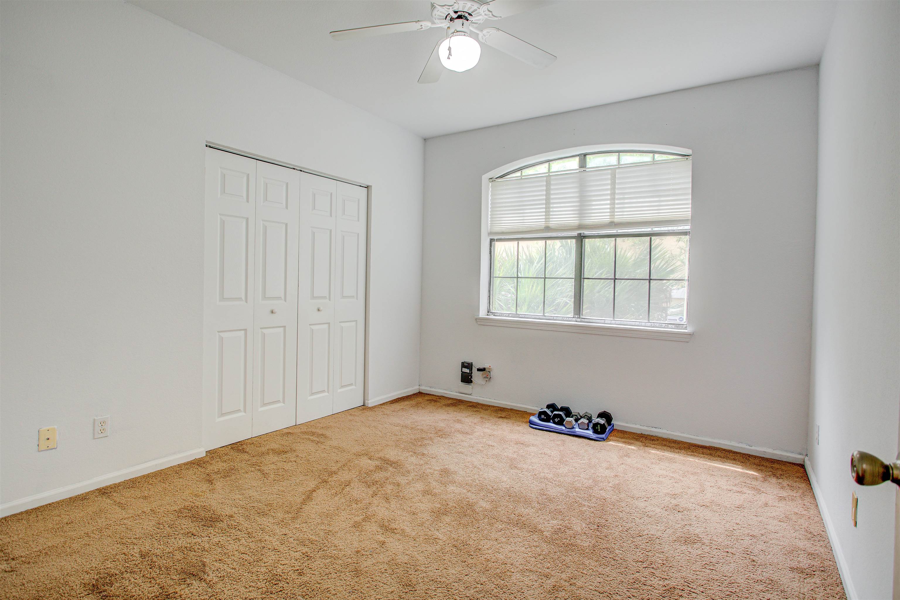 1800 Vista Cove Road St. Augustine, FL 32084 - Photo 30 of 69 Unfurnished bedroom with carpet flooring, a ceiling fan, and a closet