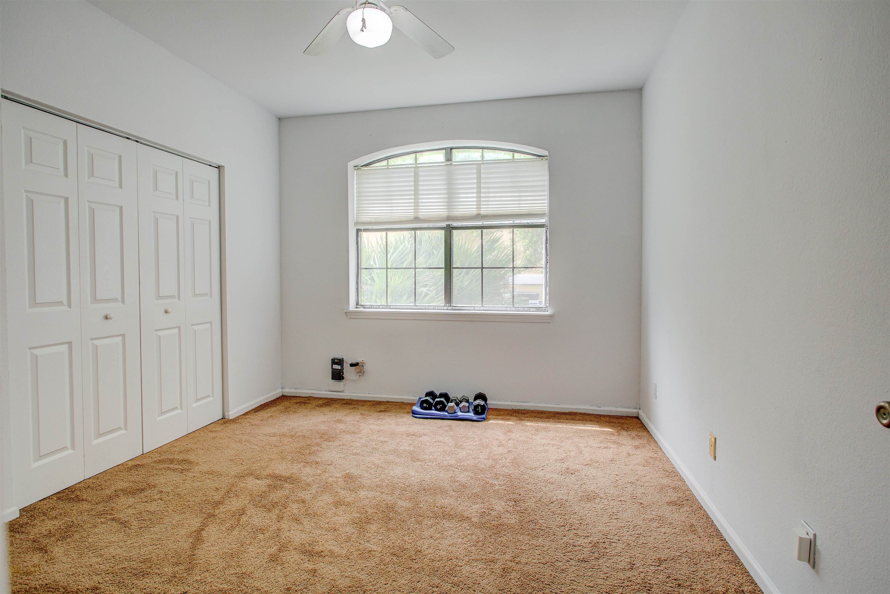 1800 Vista Cove Road St. Augustine, FL 32084 - Photo 31 of 69 Unfurnished bedroom with carpet floors, a closet, and ceiling fan
