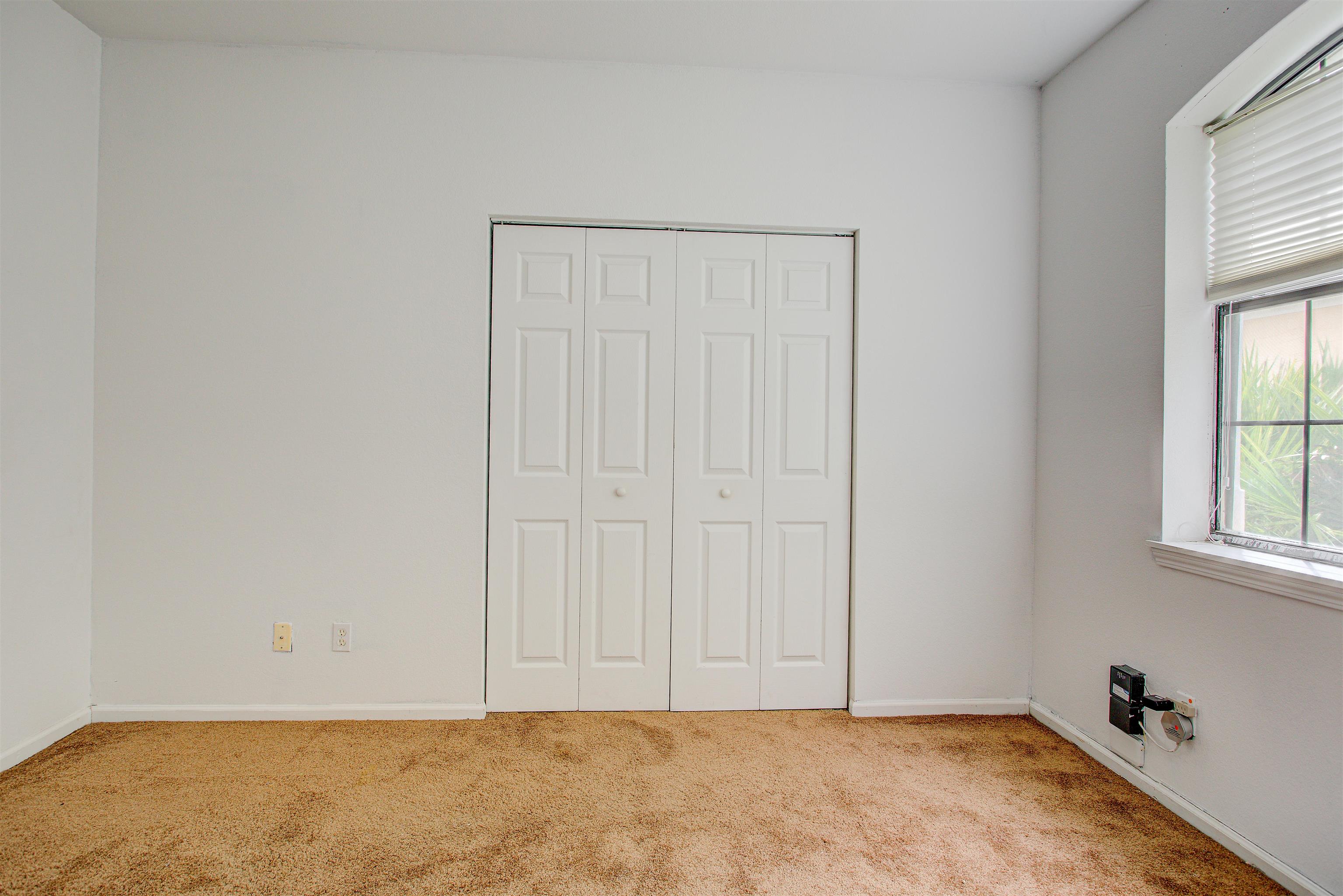 1800 Vista Cove Road St. Augustine, FL 32084 - Photo 34 of 69 Unfurnished bedroom featuring a closet and carpet