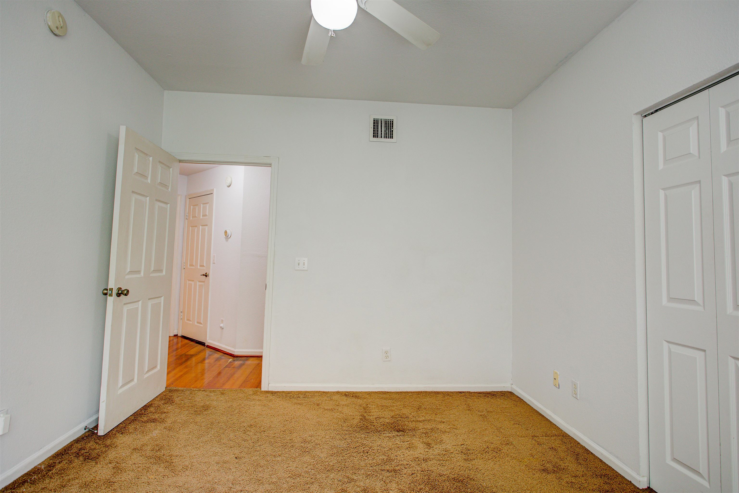 1800 Vista Cove Road St. Augustine, FL 32084 - Photo 35 of 69 Unfurnished bedroom with light colored carpet, ceiling fan, and a closet