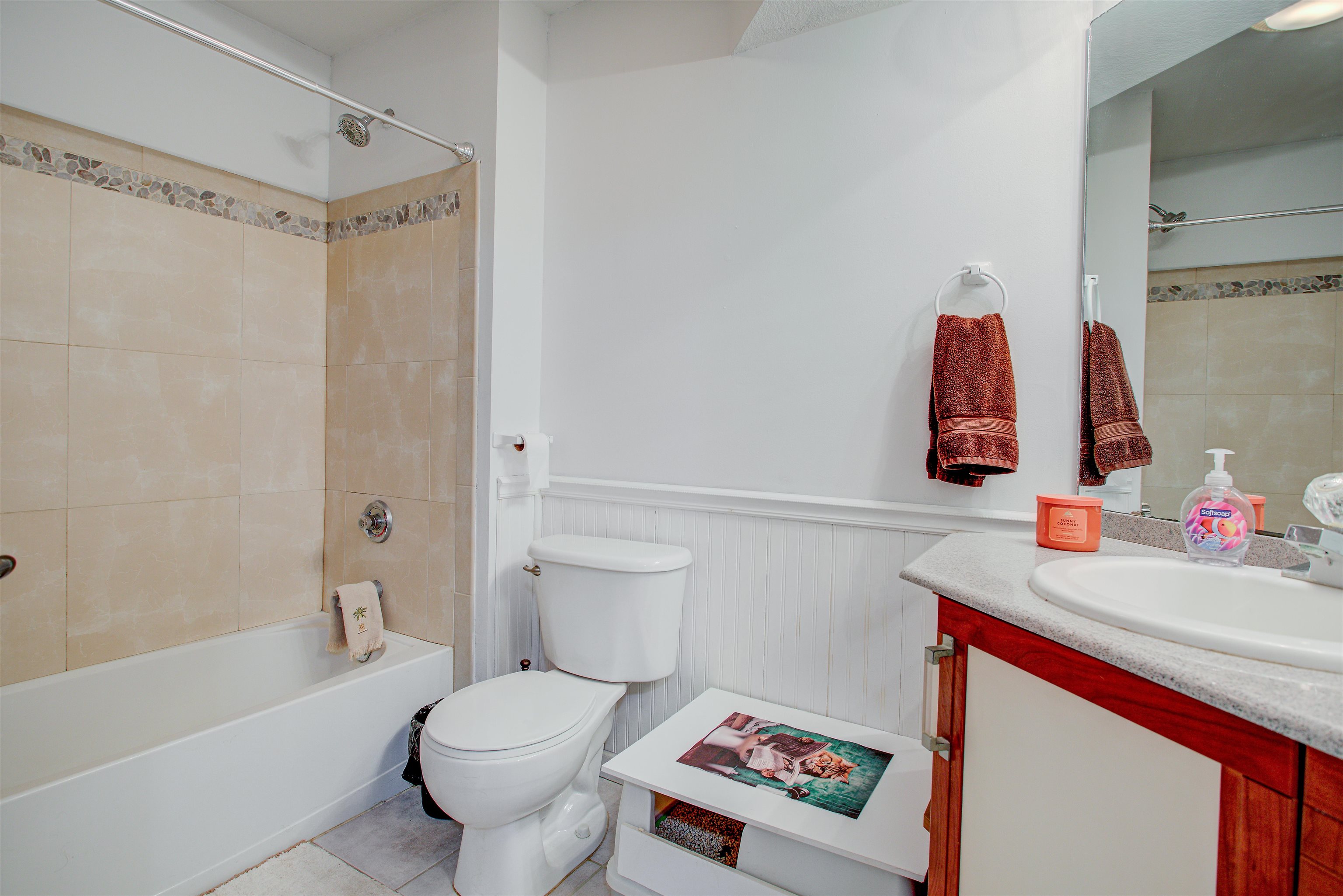 1800 Vista Cove Road St. Augustine, FL 32084 - Photo 36 of 69 Bathroom with wainscoting, vanity, and shower combination