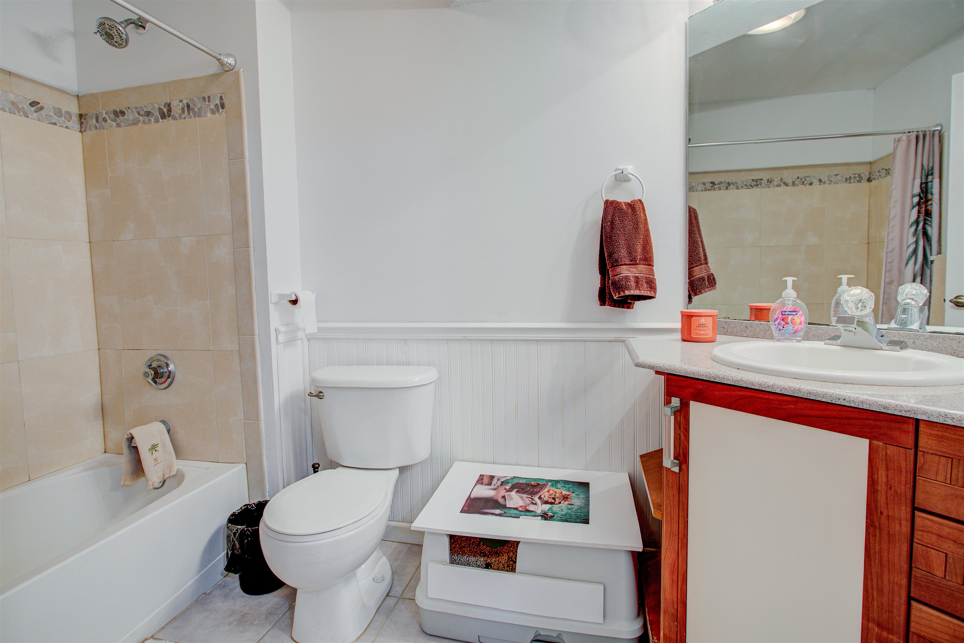 1800 Vista Cove Road St. Augustine, FL 32084 - Photo 37 of 69 Bathroom featuring a wainscoted wall, vanity, shower / bath combo with shower curtain, and light tile patterned floors