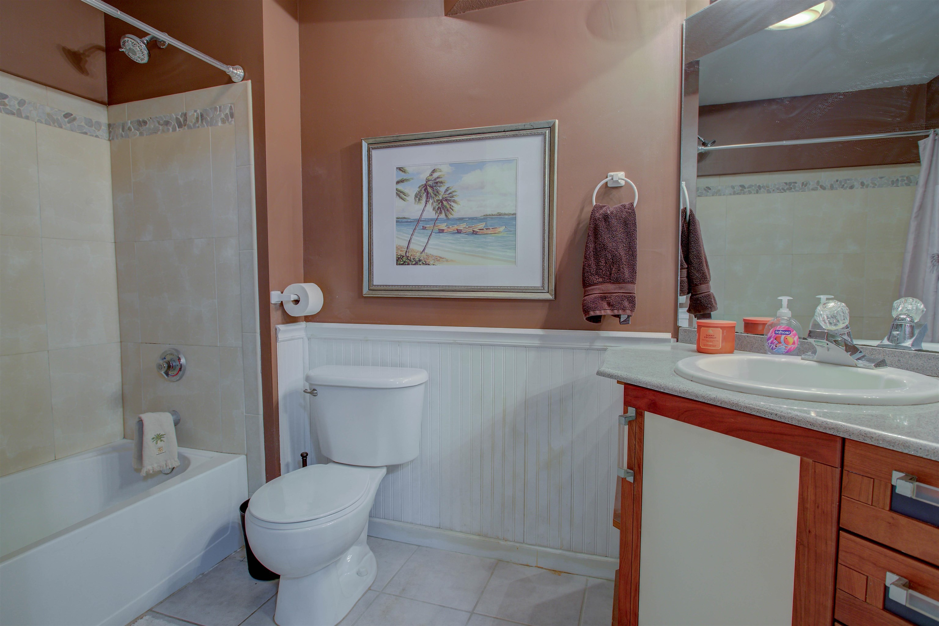 1800 Vista Cove Road St. Augustine, FL 32084 - Photo 40 of 58 Bathroom with wainscoting, vanity, shower / tub combo, and light tile patterned floors