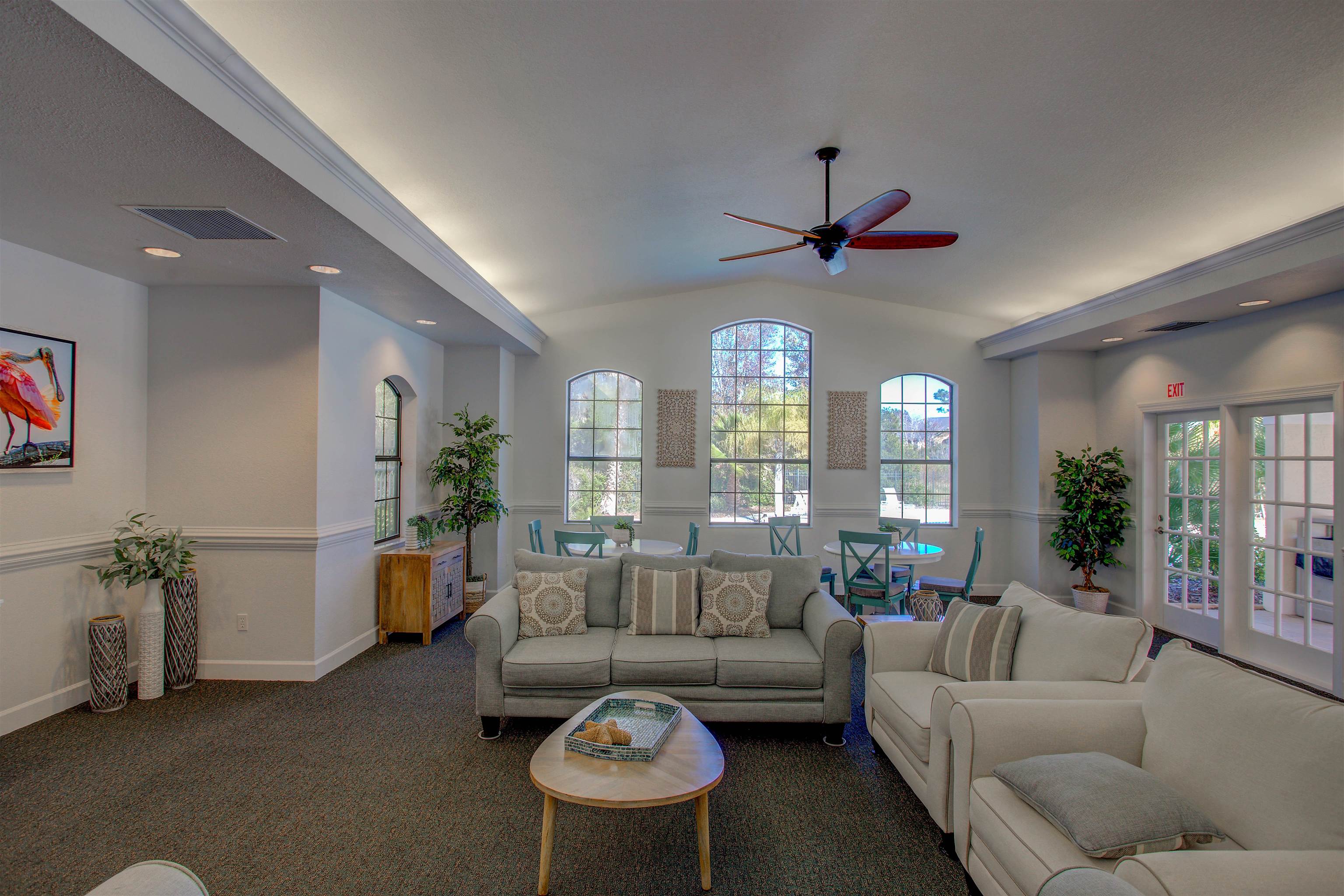 1800 Vista Cove Road St. Augustine, FL 32084 - Photo 52 of 58 a living room with furniture a chandelier and a large window