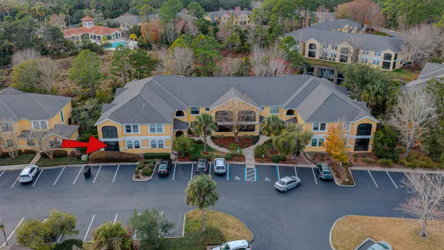 an aerial view of a house with outdoor space and a lake view