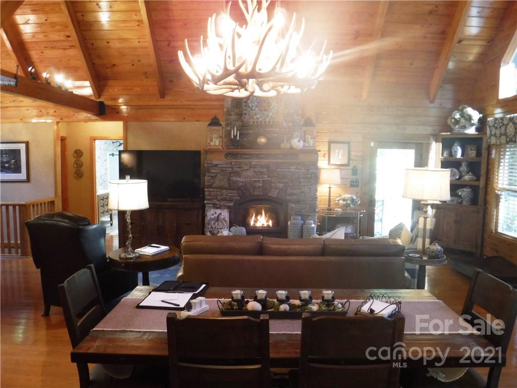 454 South Pointe Road Mill Spring, NC 28756 - Photo 8 of 47 a living room with furniture and a fireplace