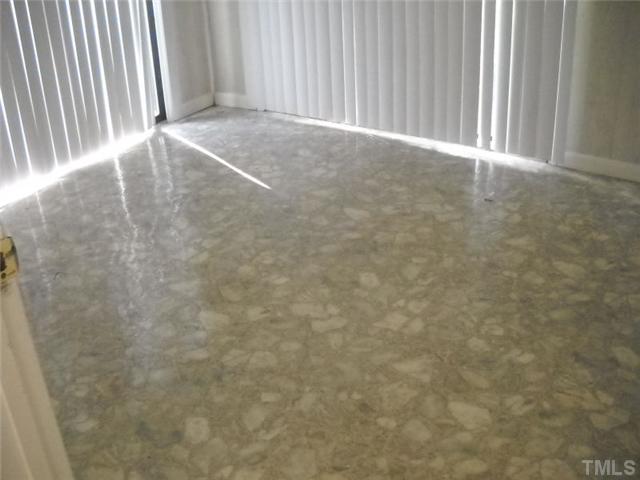 1307 Bahama Road Bahama, NC 27503 - Photo 10 of 12 Backroom/utility room. Spacious with 2 sliding glass doors.
