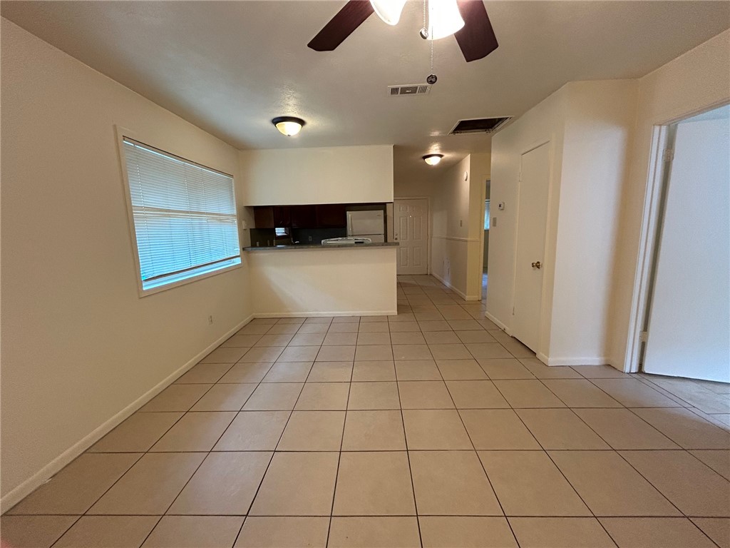 1913 Pine Tree Drive, Unit B Bryan, TX 77802 - Photo 3 of 13 a view of an empty room with a window