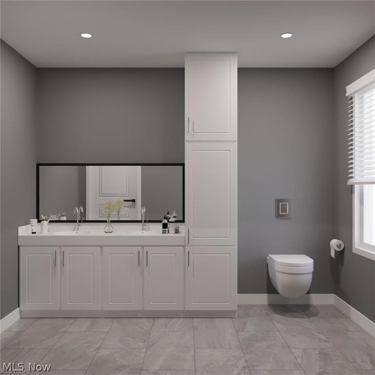 210 Sunset Road Avon Lake, OH 44012 - Photo 17 of 18 Bathroom featuring double sink vanity, toilet, and tile floors