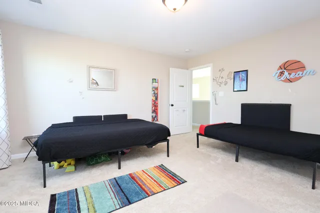 a living room with furniture and a rug