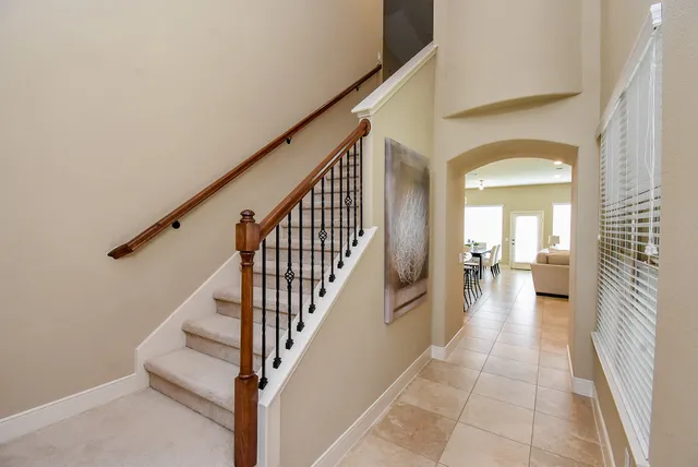 a view of a hallway view with staircase