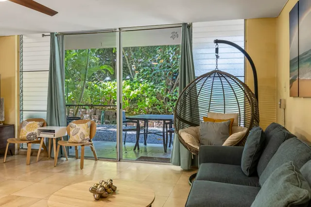 a living room with furniture and a window