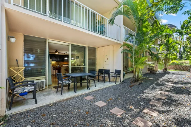 a view of a building with sitting area