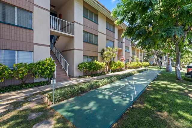 a view of a building with a yard