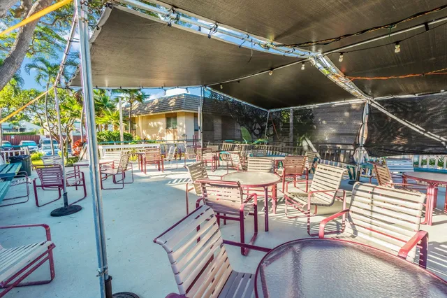 a patio with table and chairs