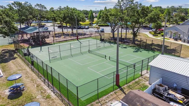 an aerial view of a house with garden space and sitting area