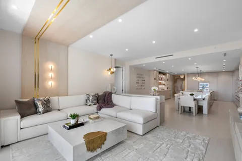 a view of a house with swimming pool and sitting area