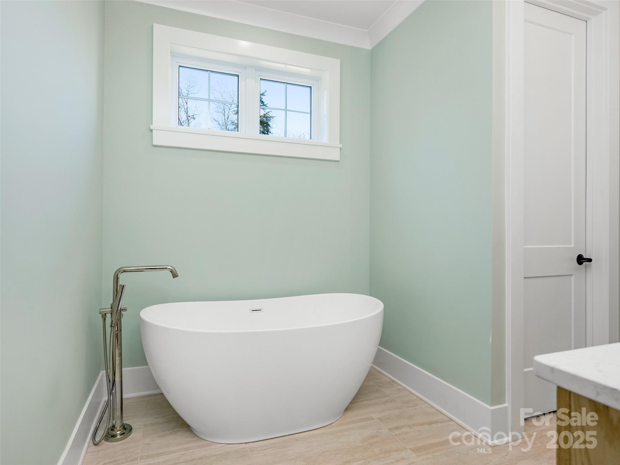597 Evergreen Road Clover, SC 29710 - Photo 11 of 23 a white tub sitting in a bathroom