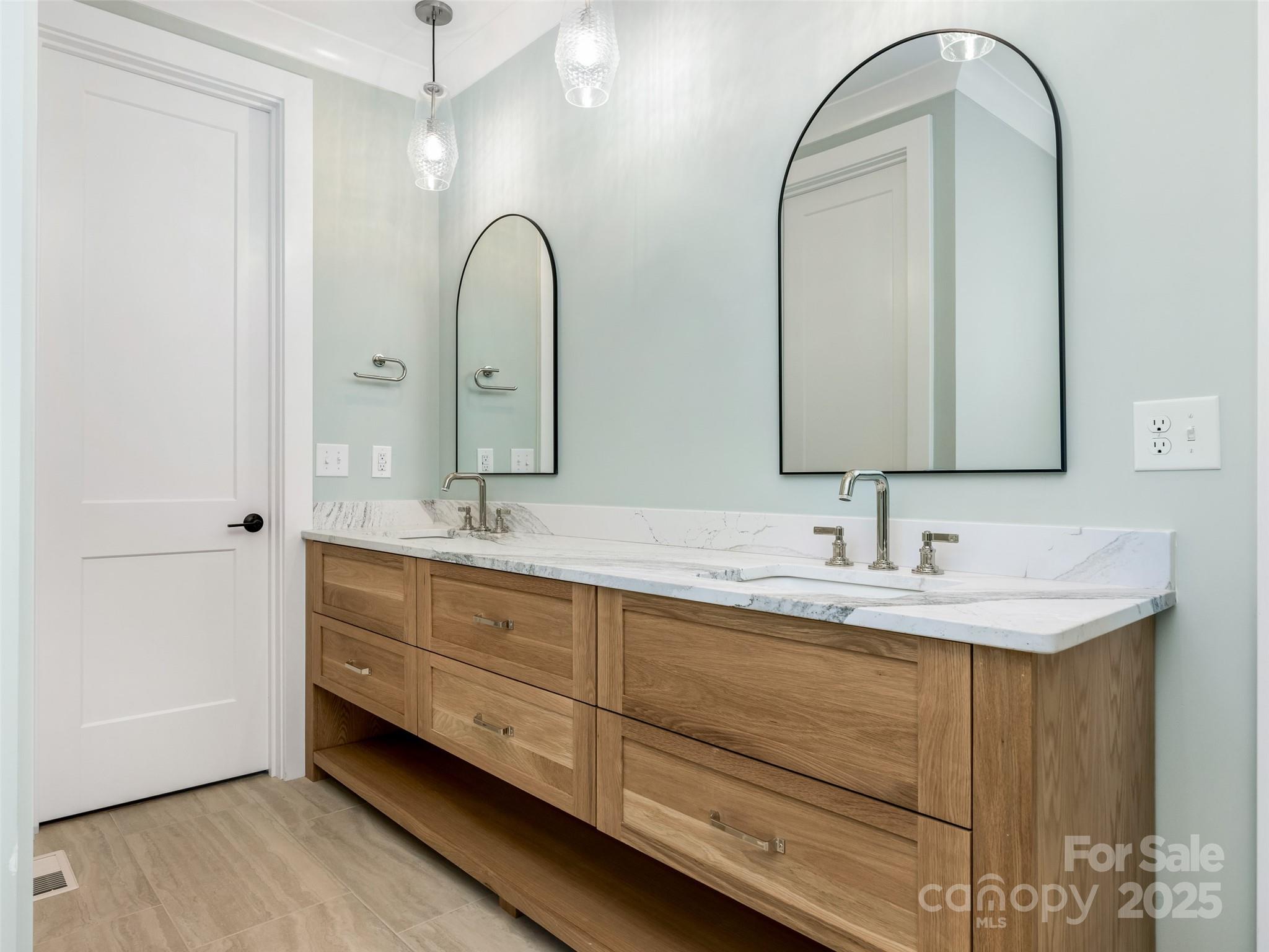 597 Evergreen Road Clover, SC 29710 - Photo 12 of 23 a bathroom with a double vanity sink and a mirror