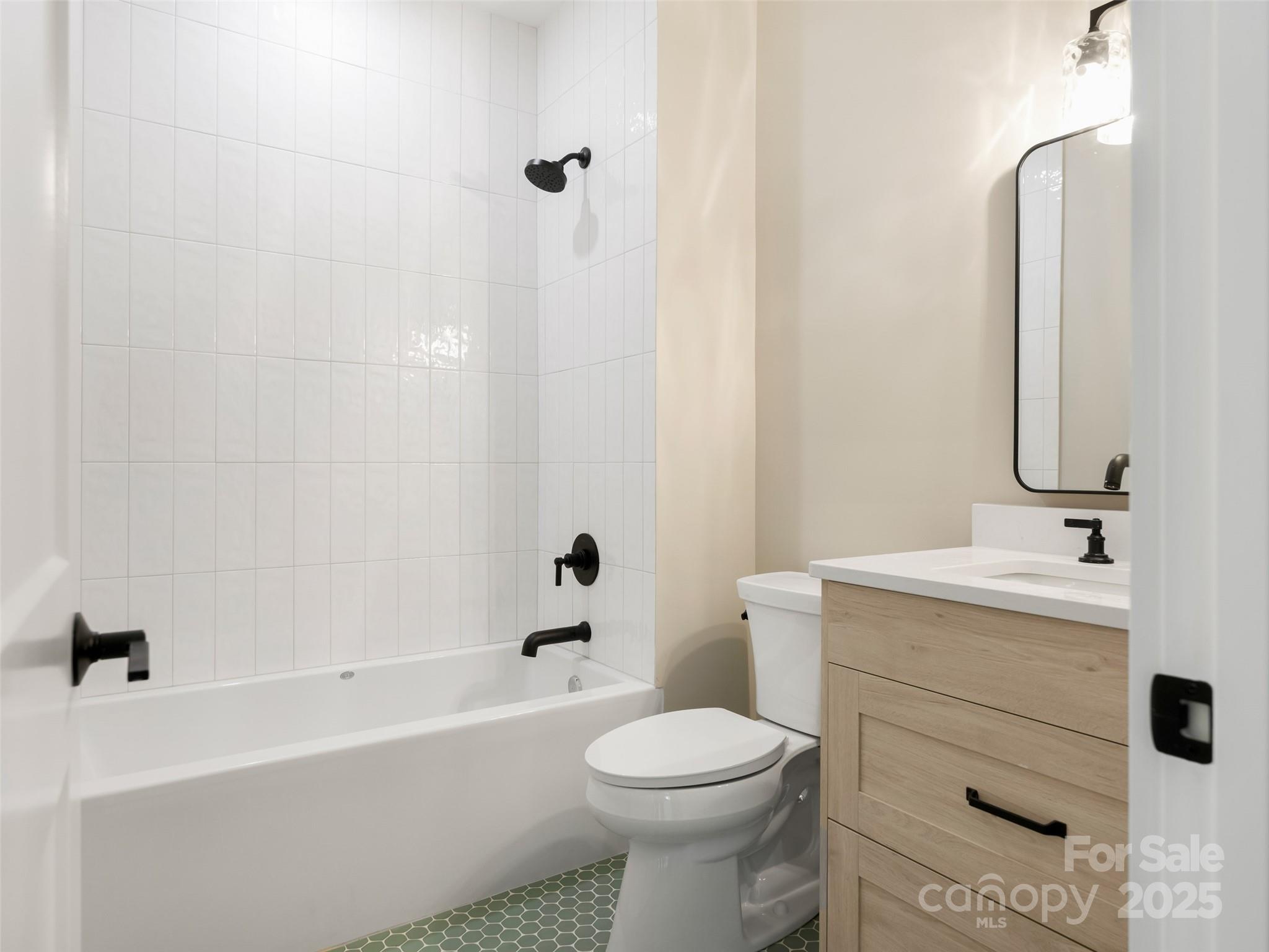597 Evergreen Road Clover, SC 29710 - Photo 16 of 23 a bathroom with a sink a toilet and shower