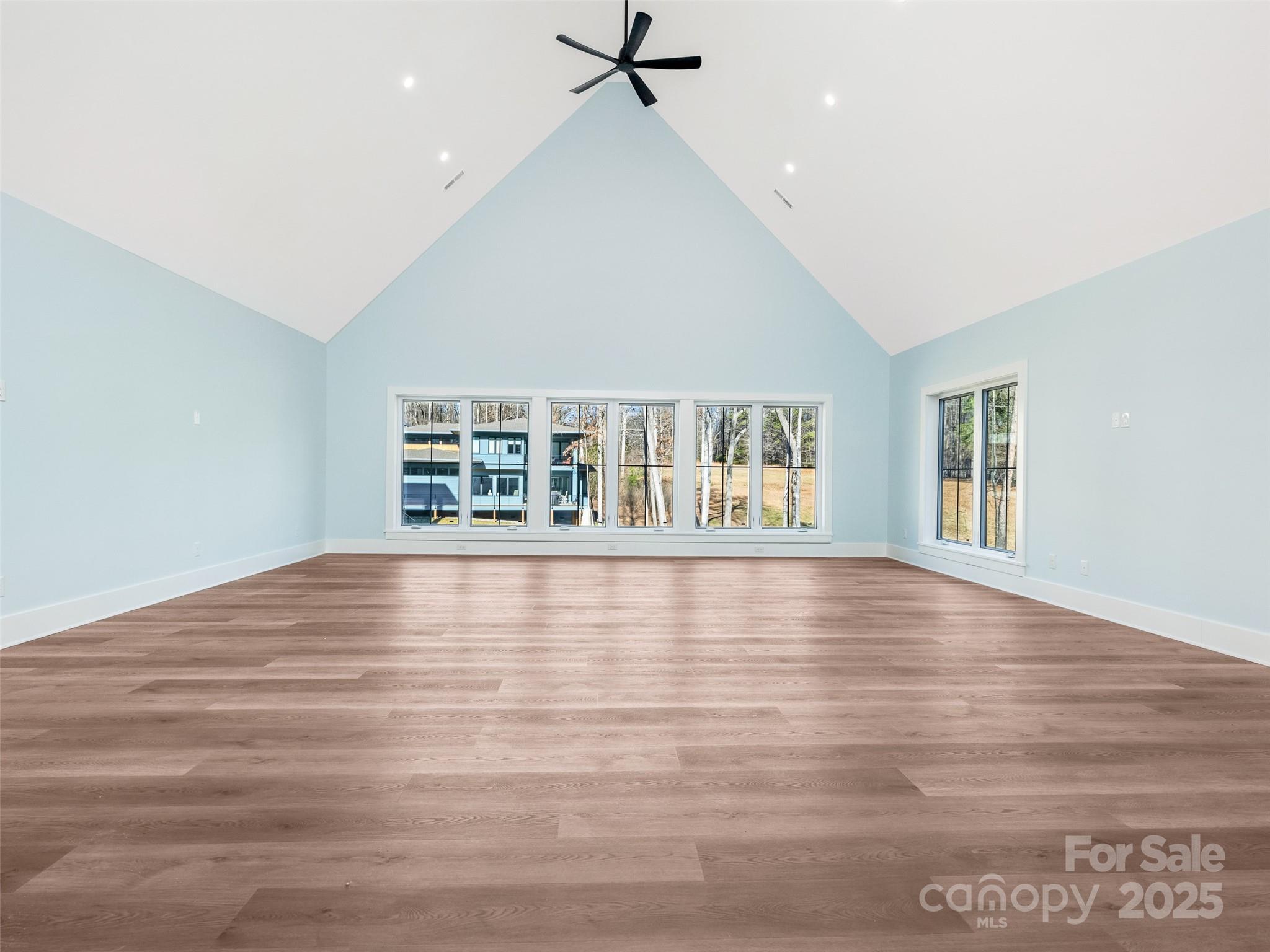597 Evergreen Road Clover, SC 29710 - Photo 18 of 23 an empty room with wooden floor and windows