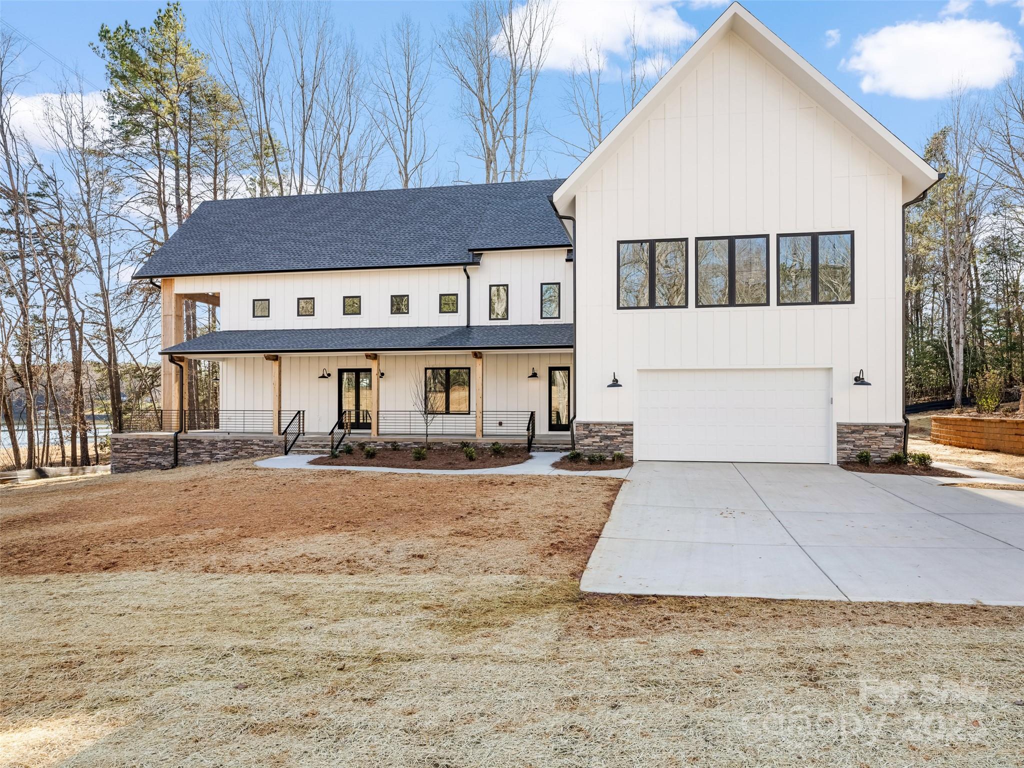 597 Evergreen Road Clover, SC 29710 - Photo 2 of 23 a front view of a house with a yard and garage