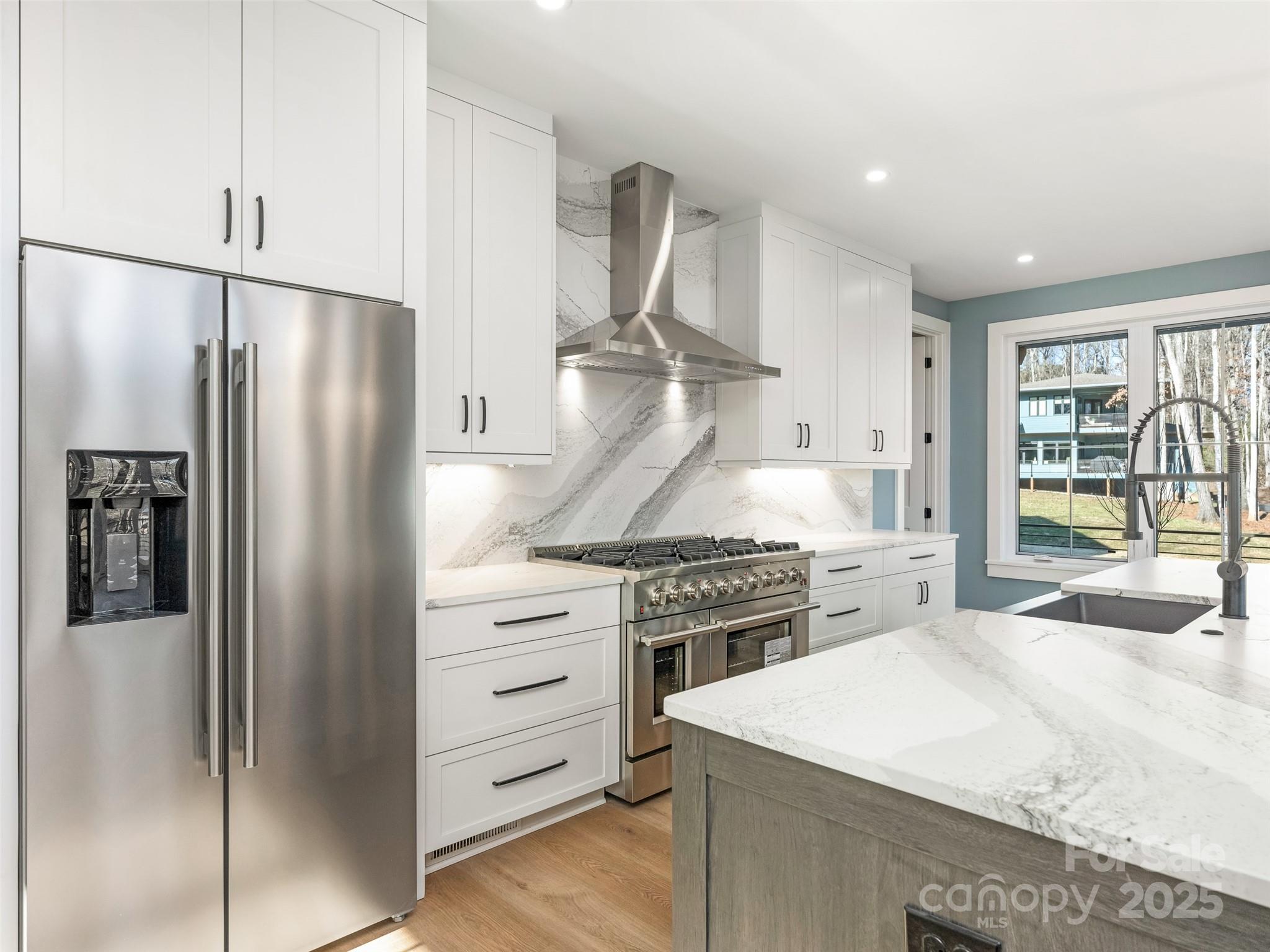 597 Evergreen Road Clover, SC 29710 - Photo 6 of 23 a kitchen with stainless steel appliances granite countertop a refrigerator stove top oven and sink