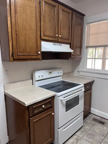 a kitchen with a stove and a microwave