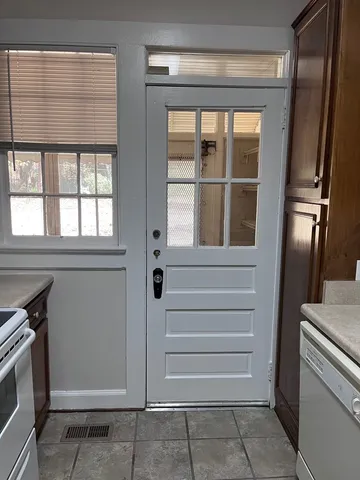 a view of an entryway with a kitchen