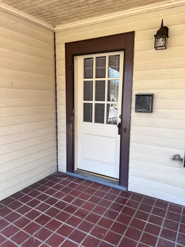 a view of a door and a window