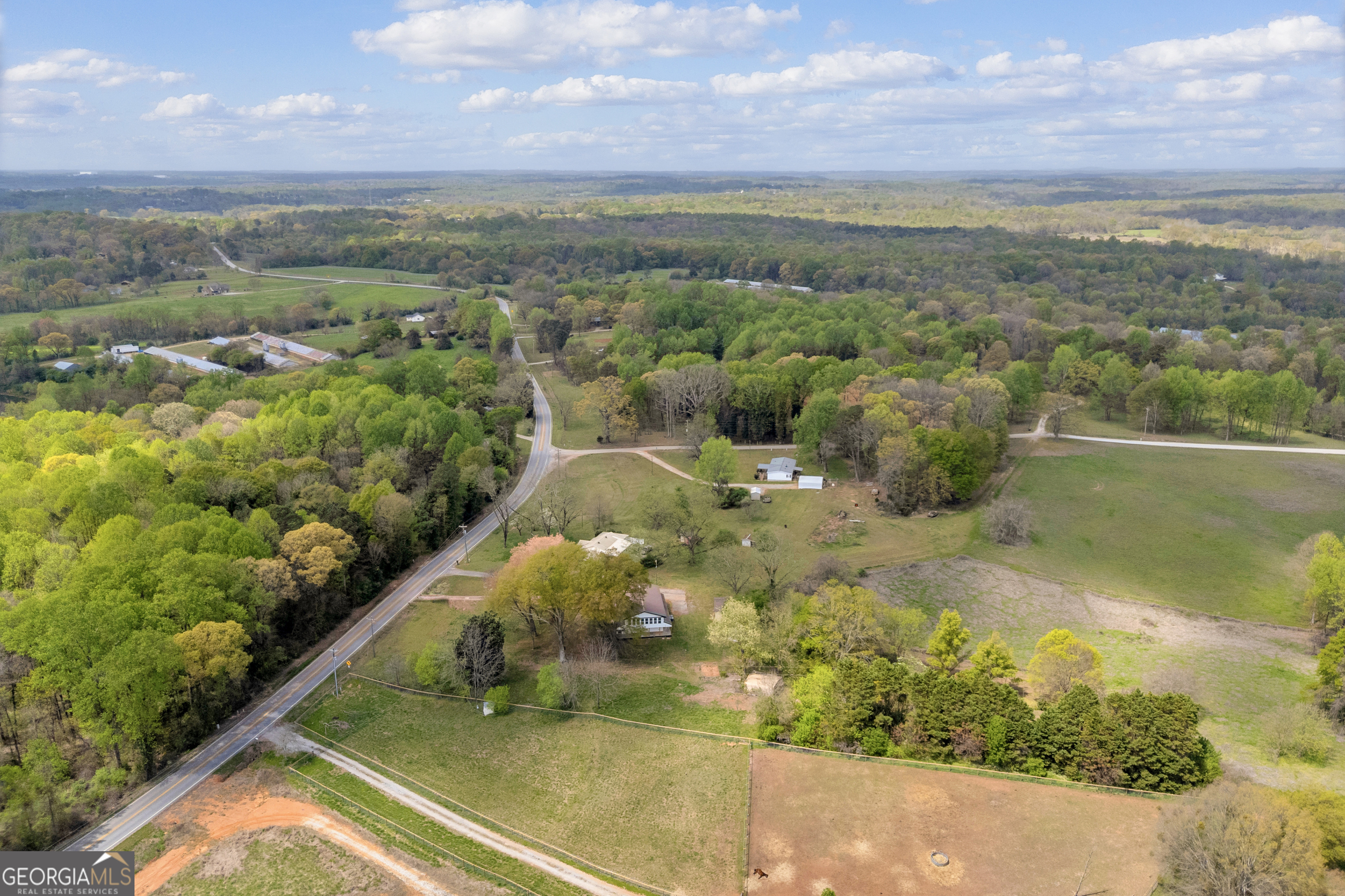 8606 Holly Springs Road Maysville, GA 30558 - Photo 67 of 74 a view of a lake with a city