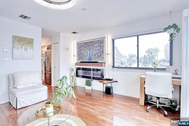 a living room with furniture and a dining room