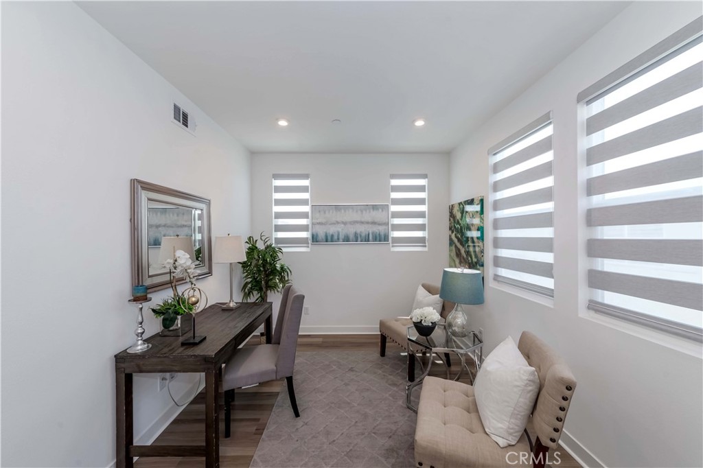 1403 West Bushell Street Anaheim, CA 92805 - Photo 16 of 31 a living room with furniture and a window